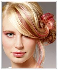 Updo with pink streaks of hair color